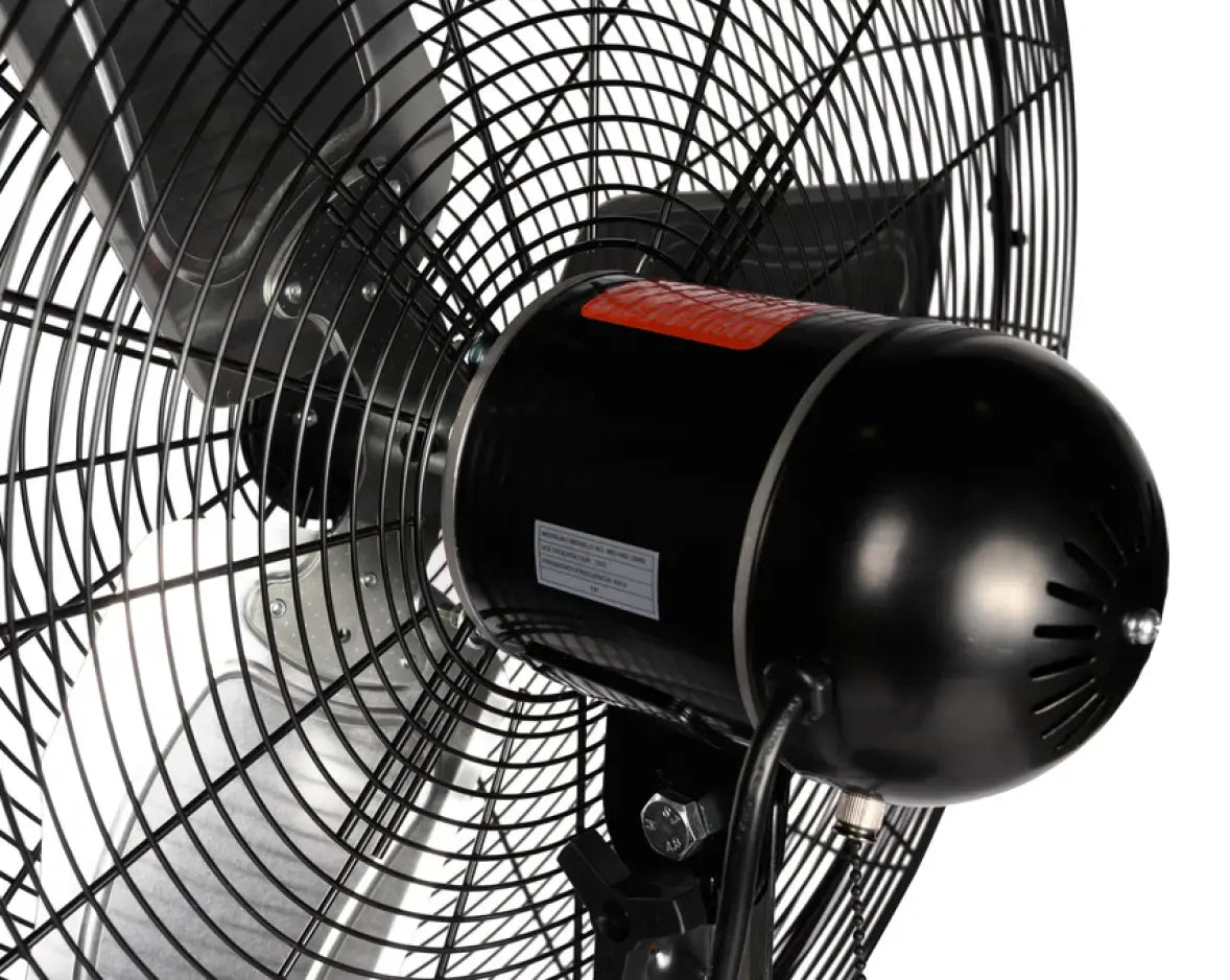 Close-up of a pedestal fan’s motor on a white background.