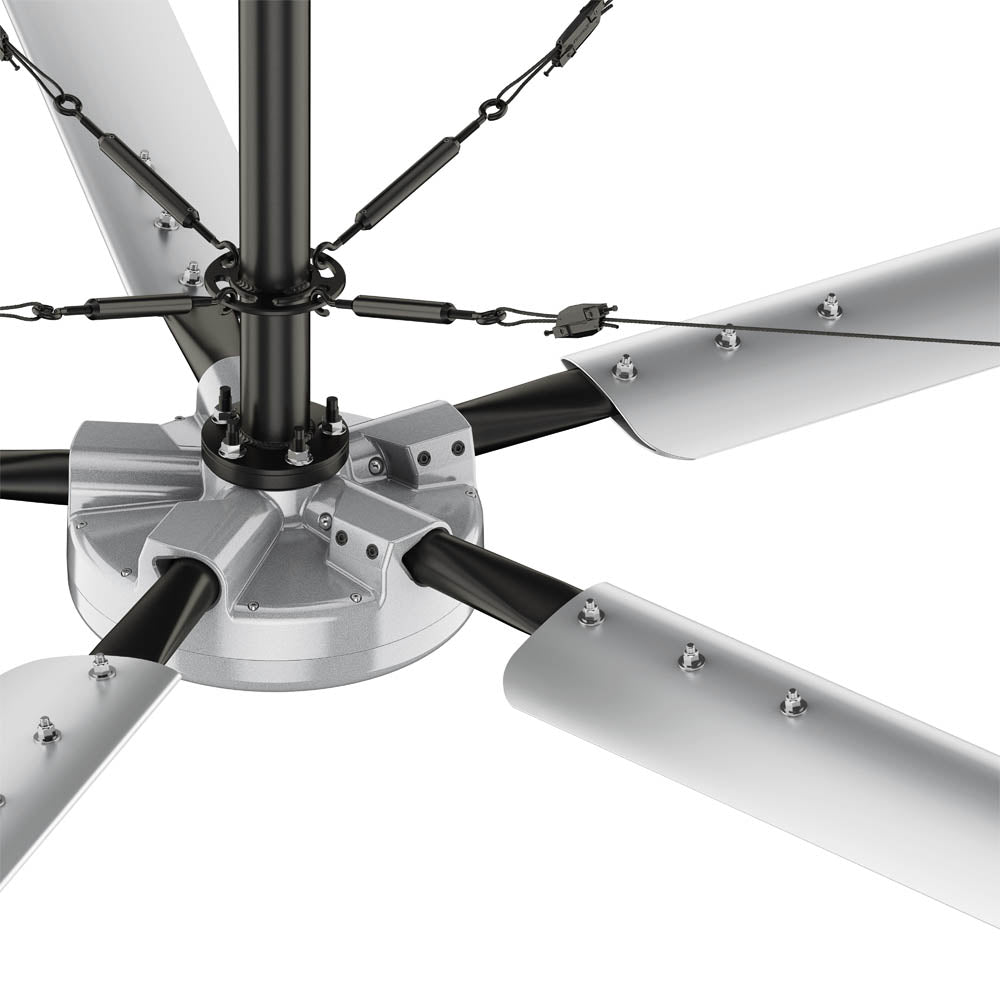 Close-up of the Hunter industrial Titan ceiling fan motor with aluminum blades, guy wires, and adjustable downrod.